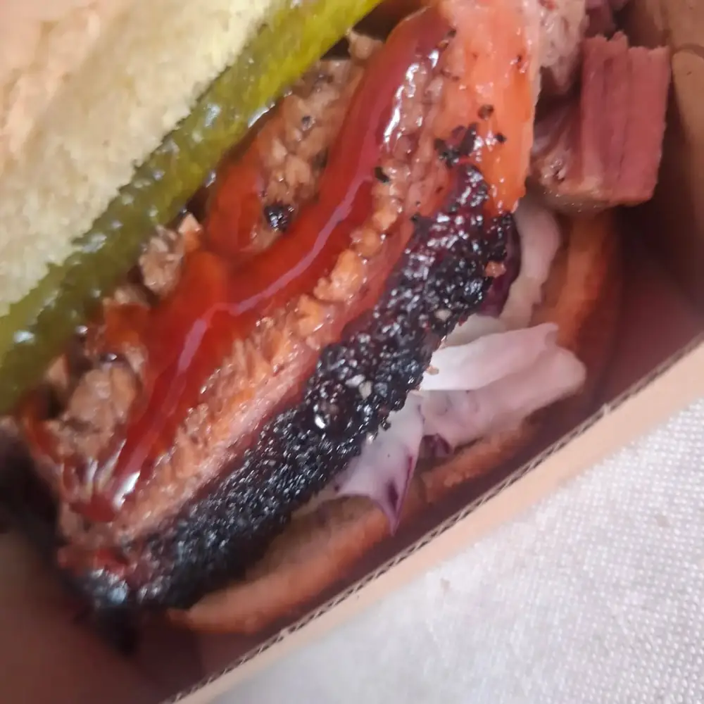 Smoked brisket roll with slaw, pickles and BBQ sauce