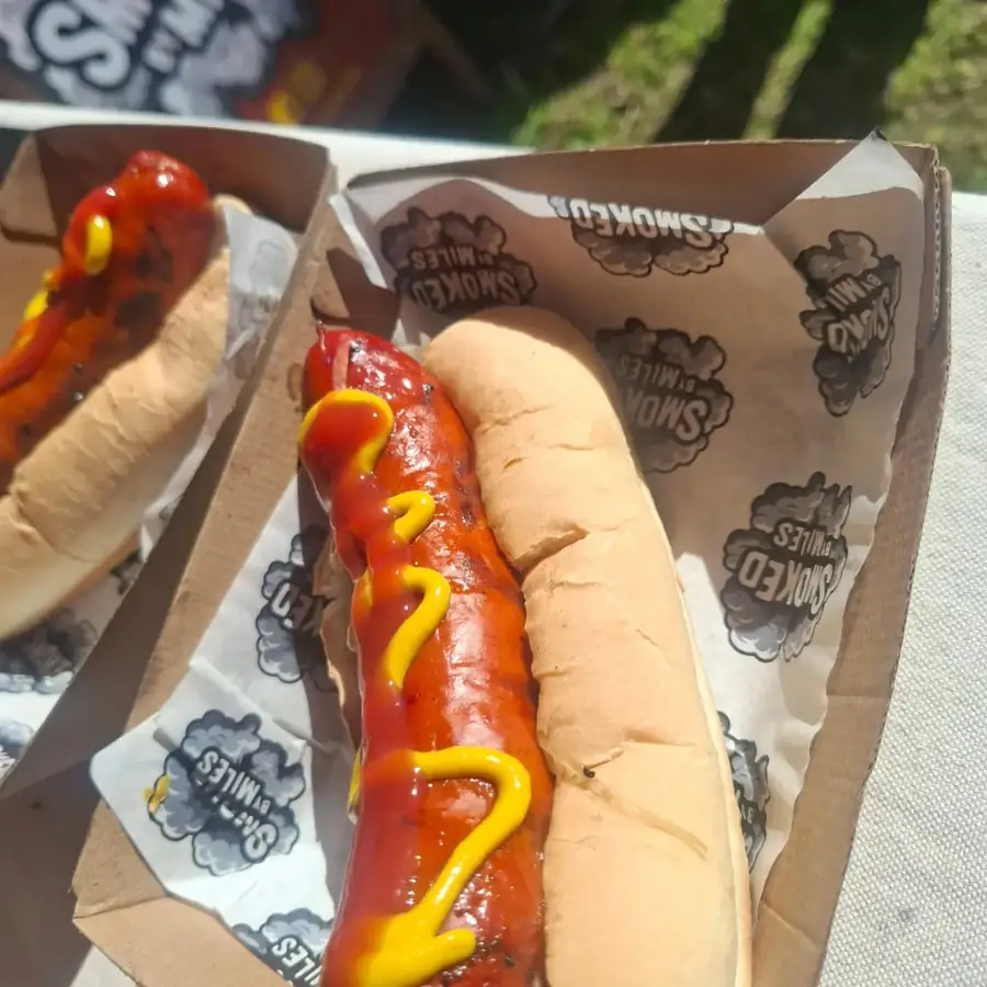 Cheese kransky hot dog with mustard and tomato sauce